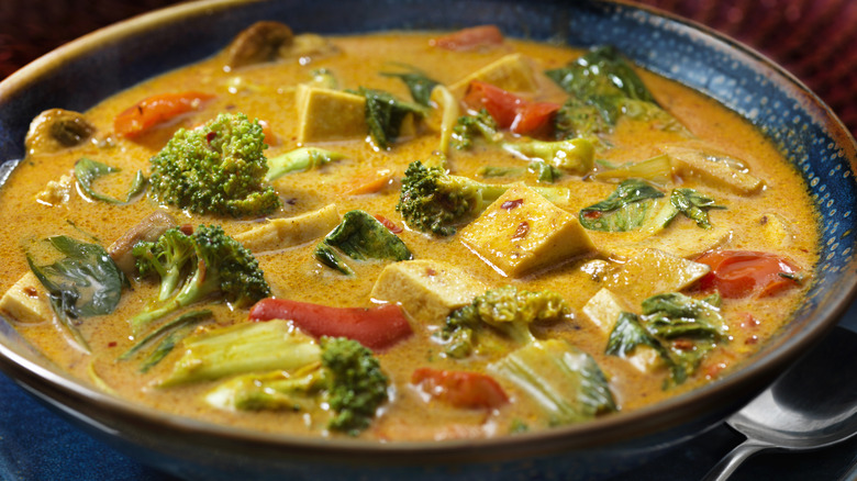 Tofu curry with vegetables in a blue dish