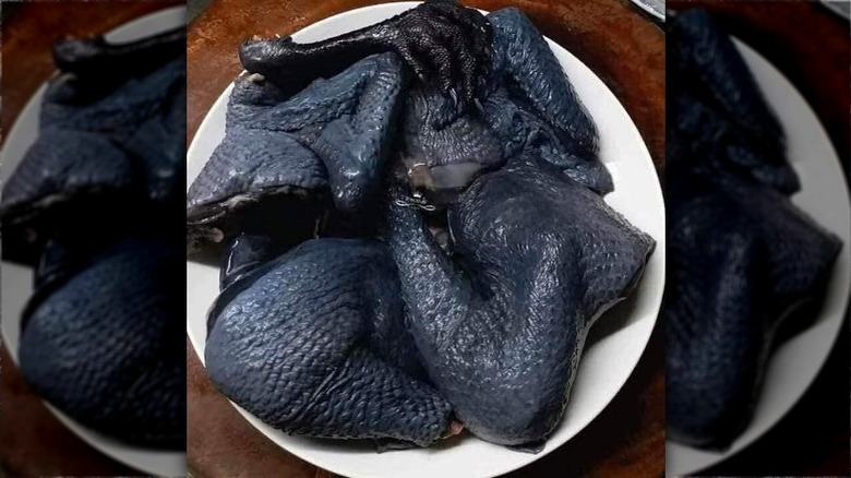 raw ayam cemani black chicken pieces