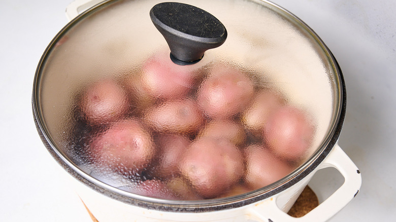 steaming potatoes in pot