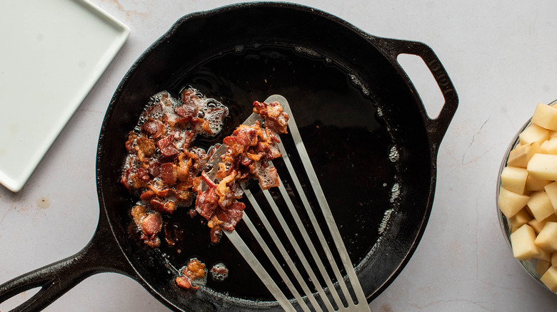 bacon cooking in a skillet 