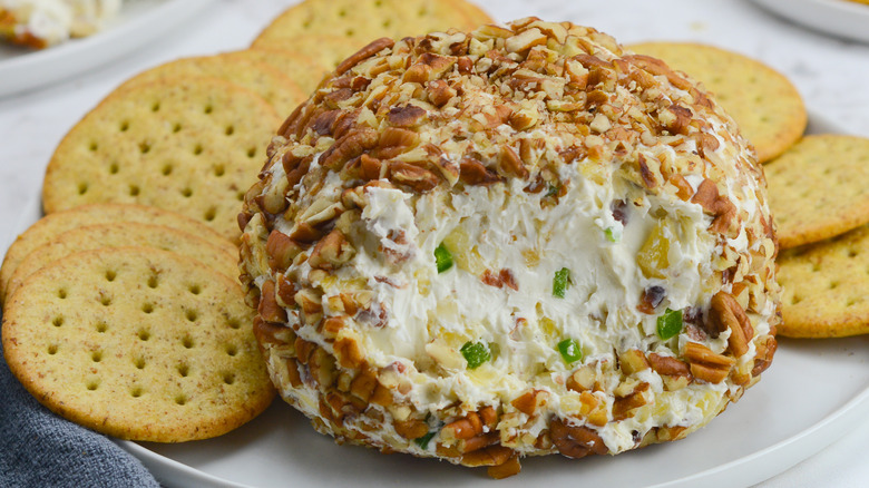 bacon jalapeno cheese ball on plate with crackers