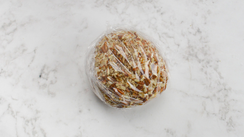 cheese ball wrapped in plastic