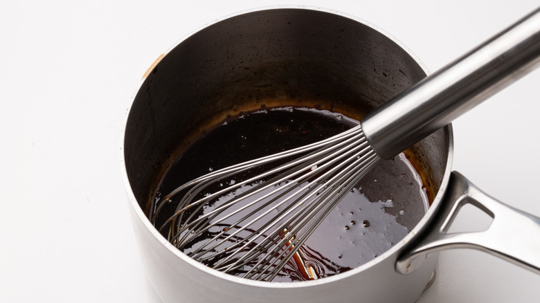 whisking glaze in a saucepan