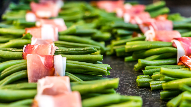 Raw beans wrapped in cured pork