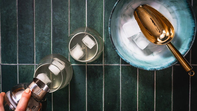 Pouring cocktail into glasses