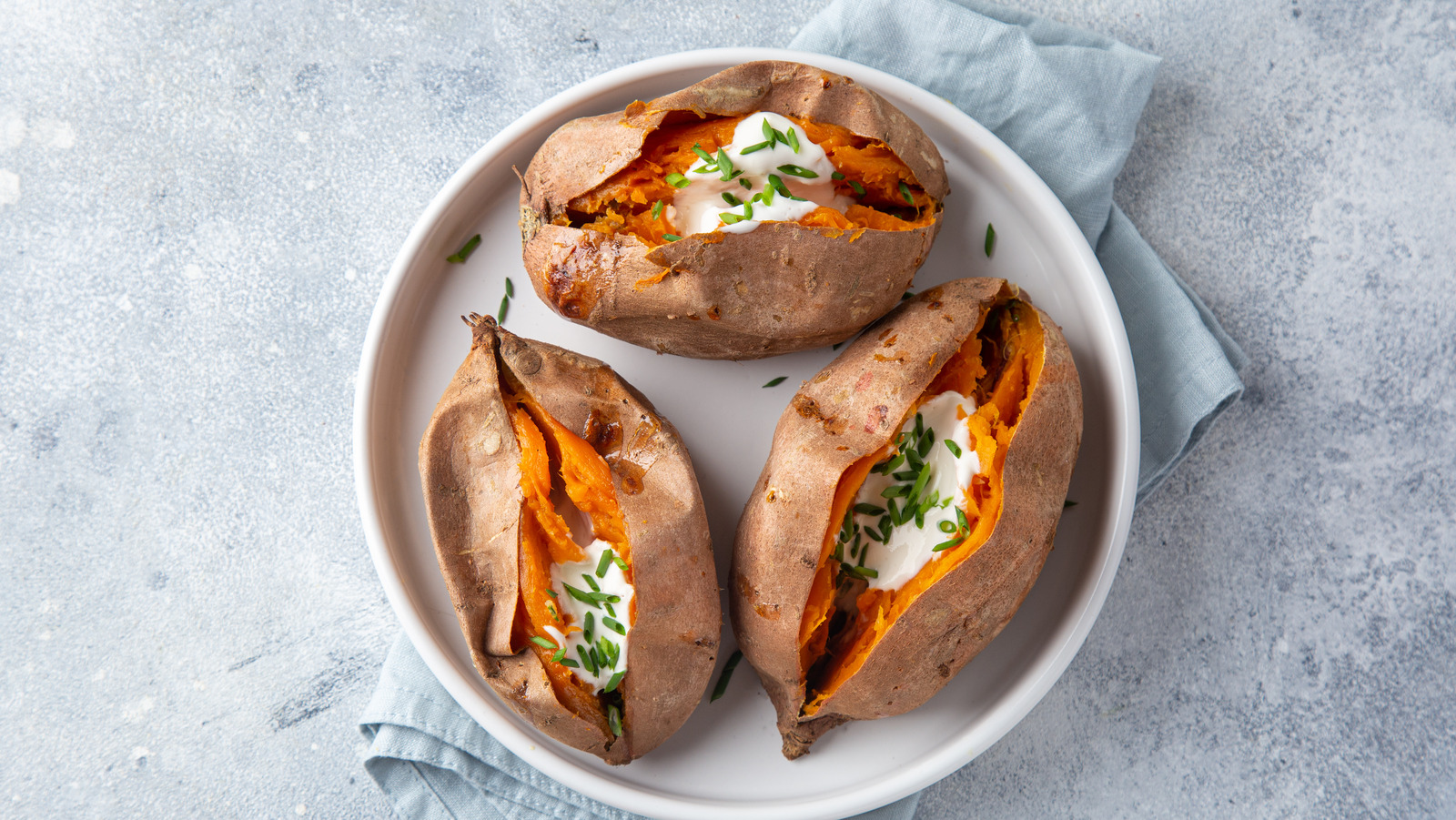 https://www.tastingtable.com/img/gallery/bake-sweet-potatoes-from-frozen-for-the-fluffiest-results/l-intro-1680617727.jpg