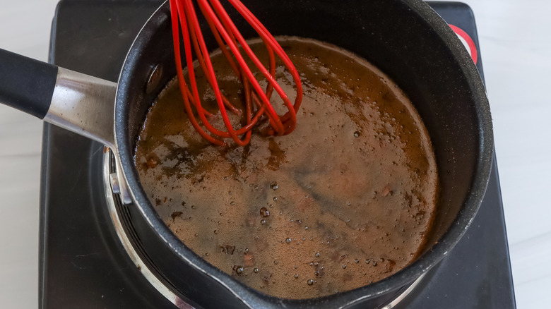 reducing marinade in saucepan