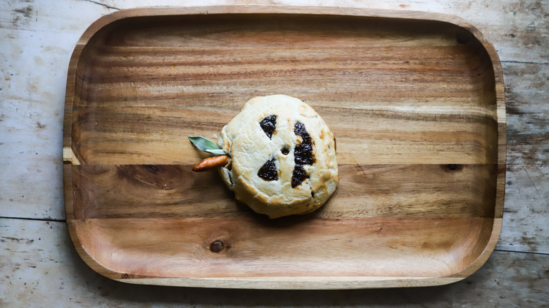 baked brie on wood board