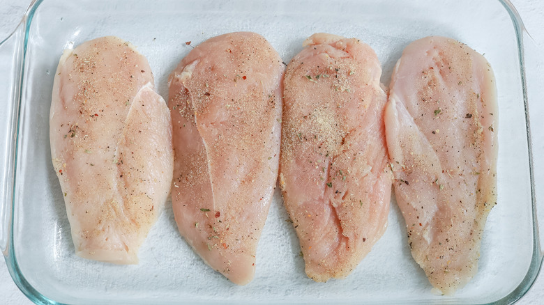 seasoned chicken breasts in dish