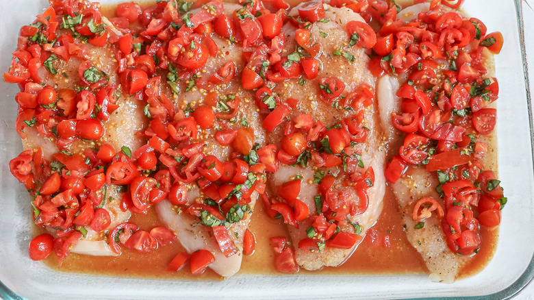 chicken dish coated with tomatoes