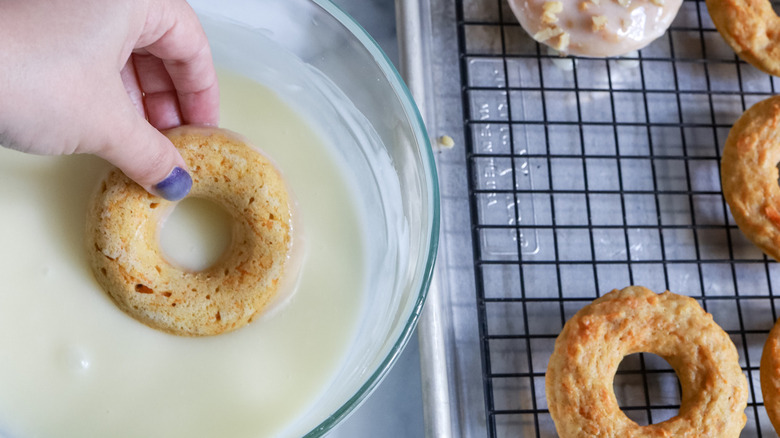 donut dunking in icing