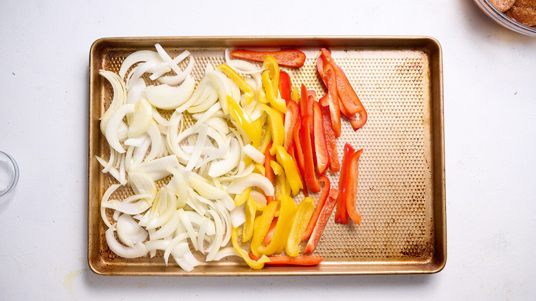 onion and peppers on sheet tray