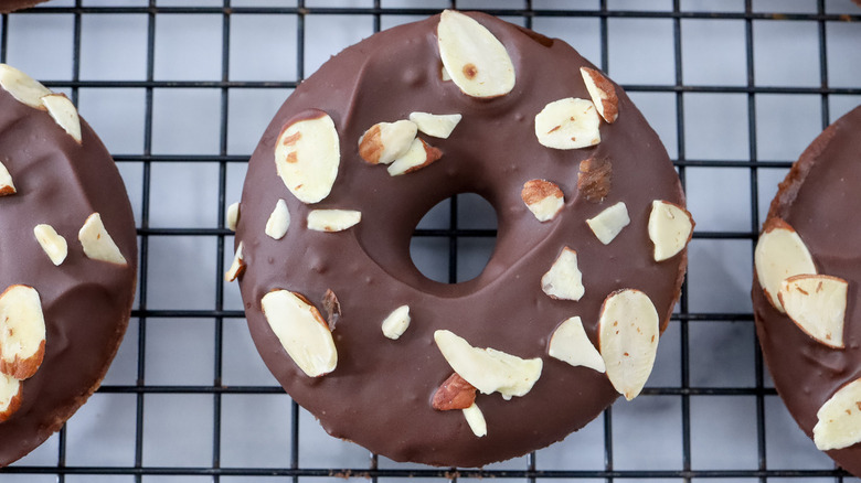 chocolate almond donut on rack