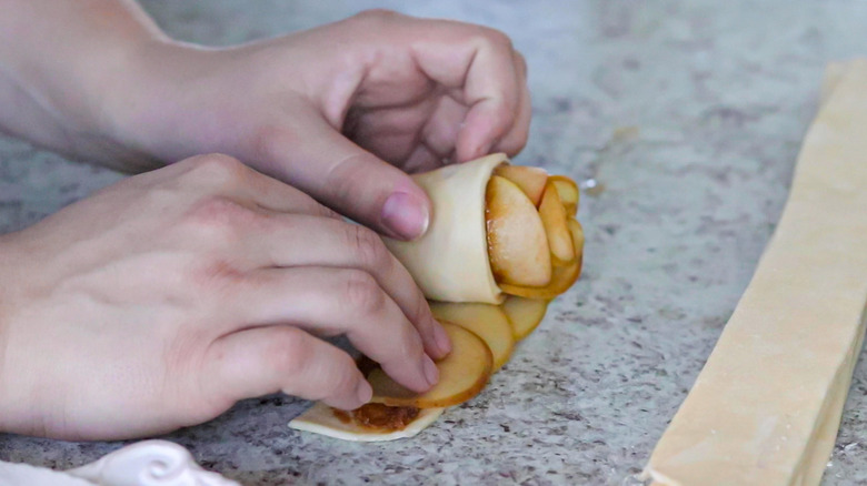 rolling an apple into rose