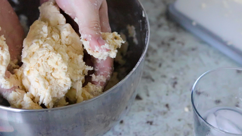 metal bowl filled with dough