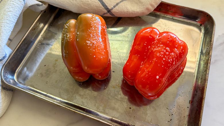 2 peppers on baking sheet