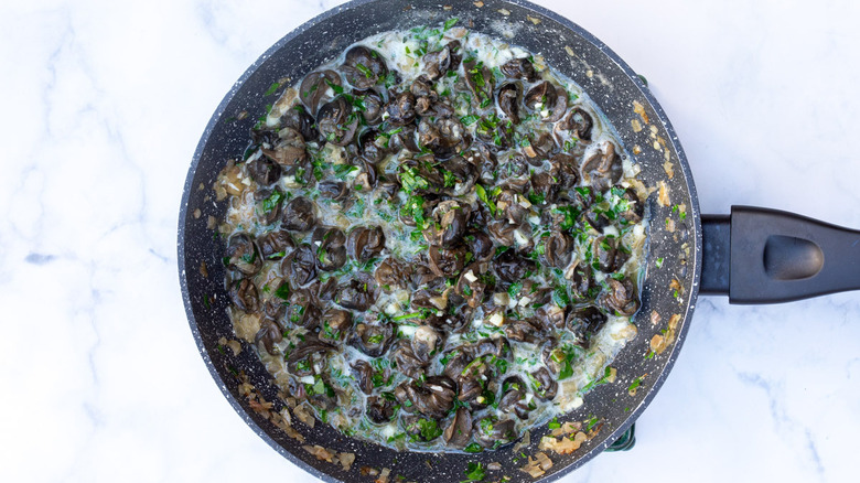 homemade baked escargot in a skillet