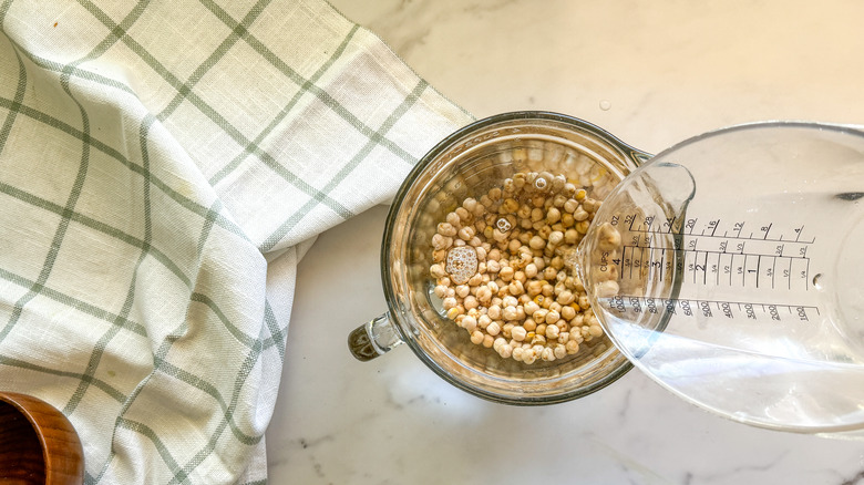 adding water to chickpeas