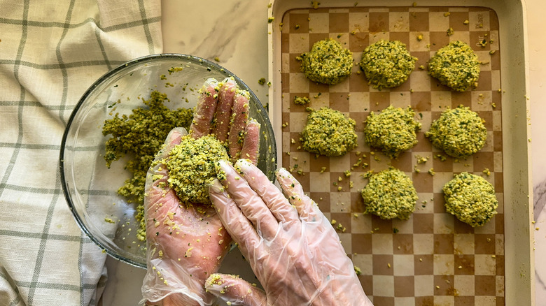 hands shaping falafel patties