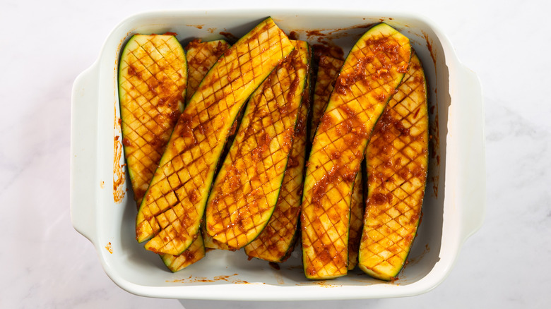 scored zucchini with marinade