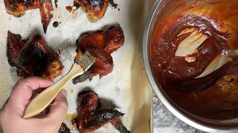 hand painting sauce on wings