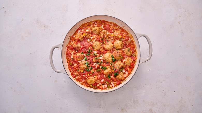 baked meatballs and orzo in skillet