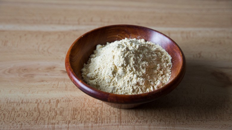 chickpea flour in wooden bowl