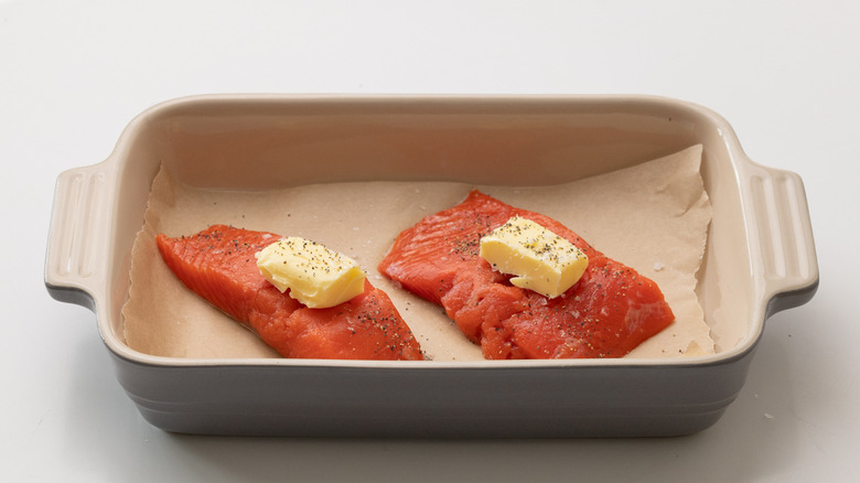 raw salmon in baking tray