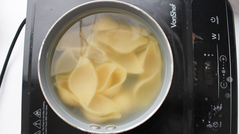 shells cooking in pot