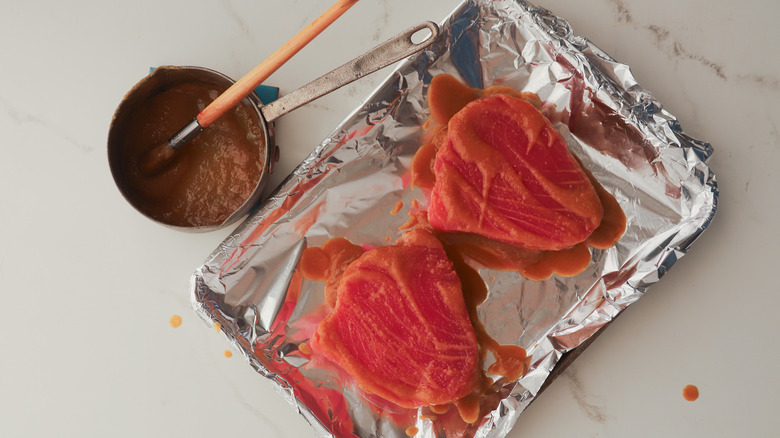 Brushing glaze onto fish