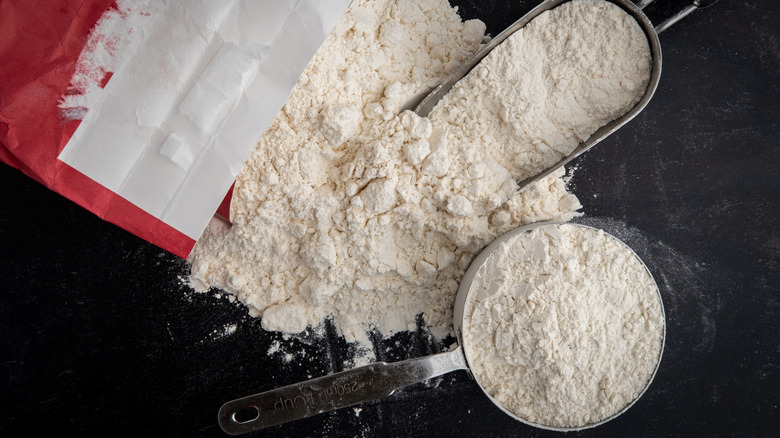 measuring cup and flour bag