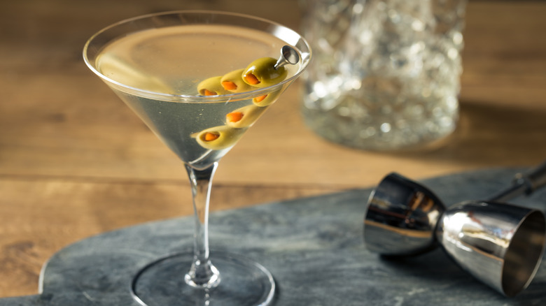 dirty martini with olive skewer