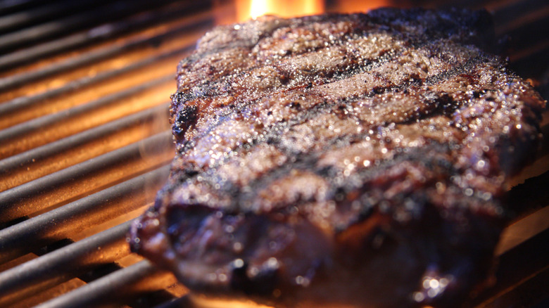 Steak cooking on grill 