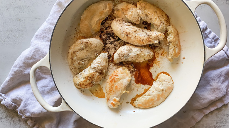 sautéed chicken tenders in pan