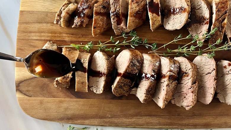 sliced roast pork on board