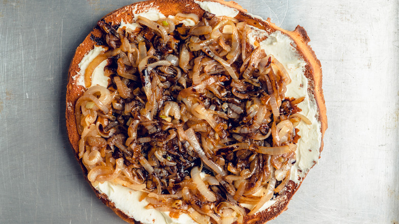 flatbread with goat cheese topped with balsamic caramelized onions
