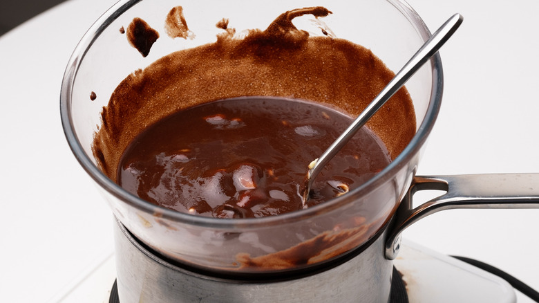 melted chocolate in bowl over bain marie