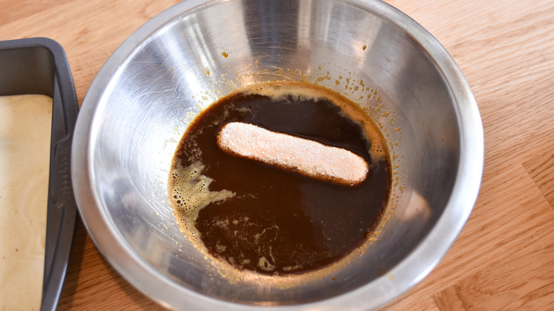 dipping ladyfingers in espresso