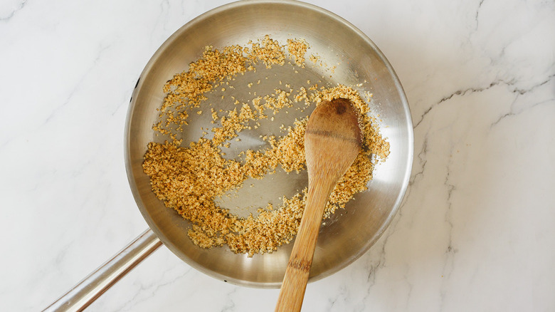 Seasoned breadcrumbs in pan