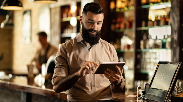 Waiter using a POS system