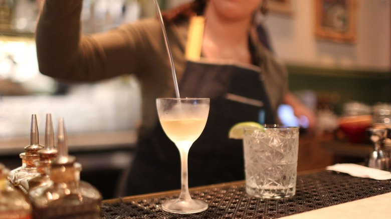 Bartender pouring martini at Bar Moruno