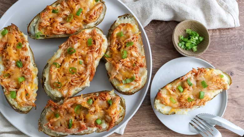 barbecue chicken-stuffed twice-baked potatoes on a table