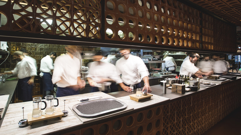 Chefs working in Disfrutar restaurant kitchen