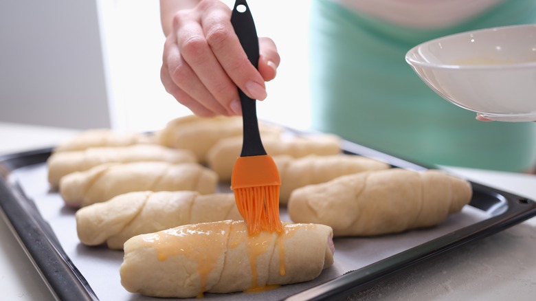 person using a pastry brush