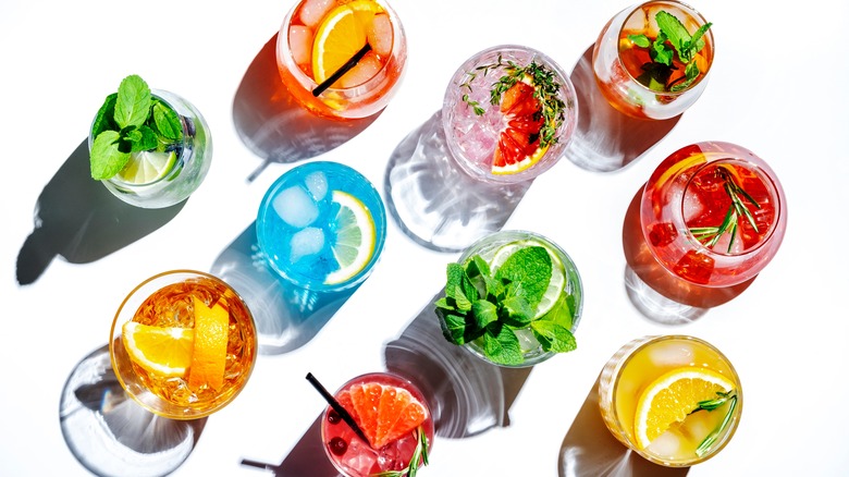 Top view of 10 colorful cocktails 