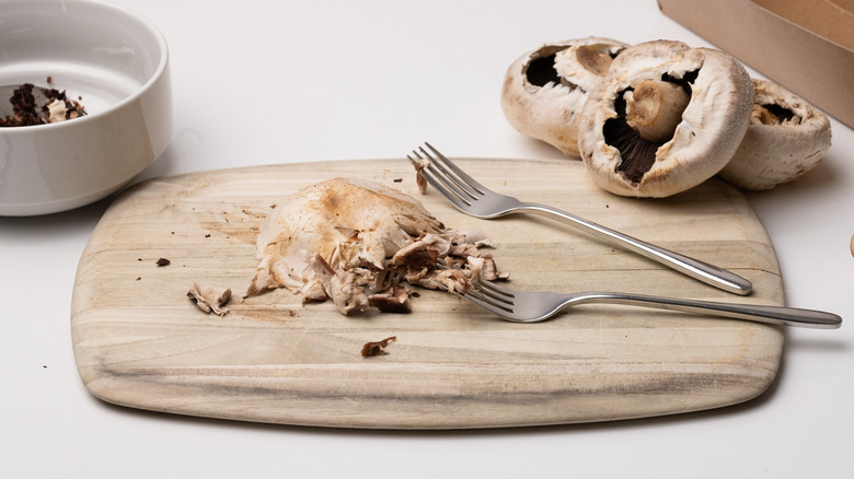 portobello mushrooms on chopping board