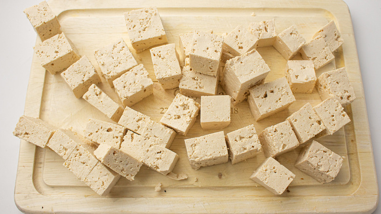 cubed tofu on cutting board