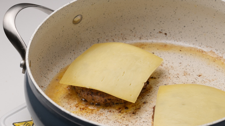 cheddar cheese on burger patties