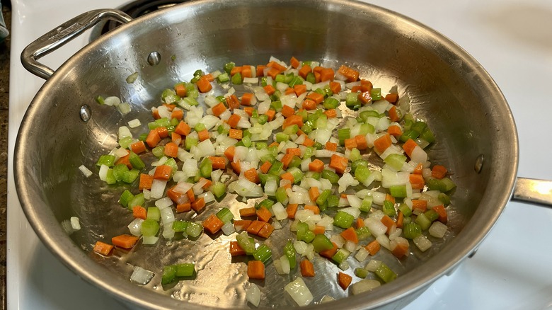 onion carrot celery cooking in pan