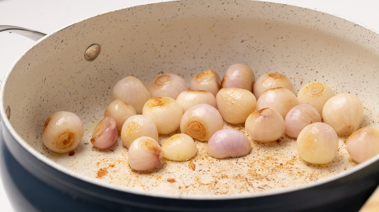 browning onions in a pan